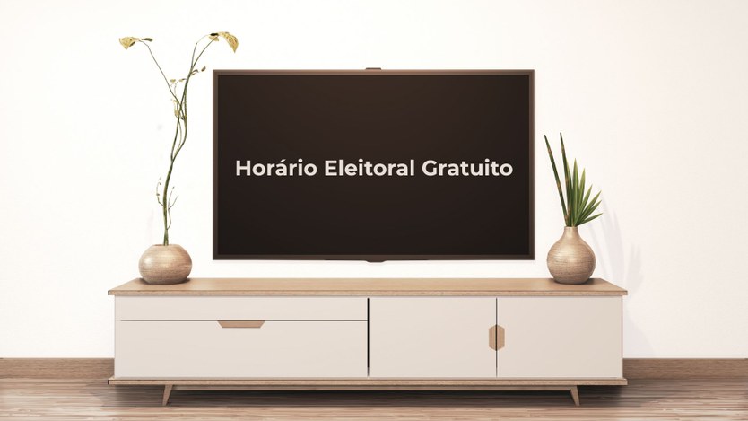 A imagem mostra uma televisão com a mensagem "Horário Eleitoral Gratuito" exibida na tela, posic...