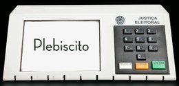 Imagem contendo uma urna eletrônica com a frase "plebiscito" na tela